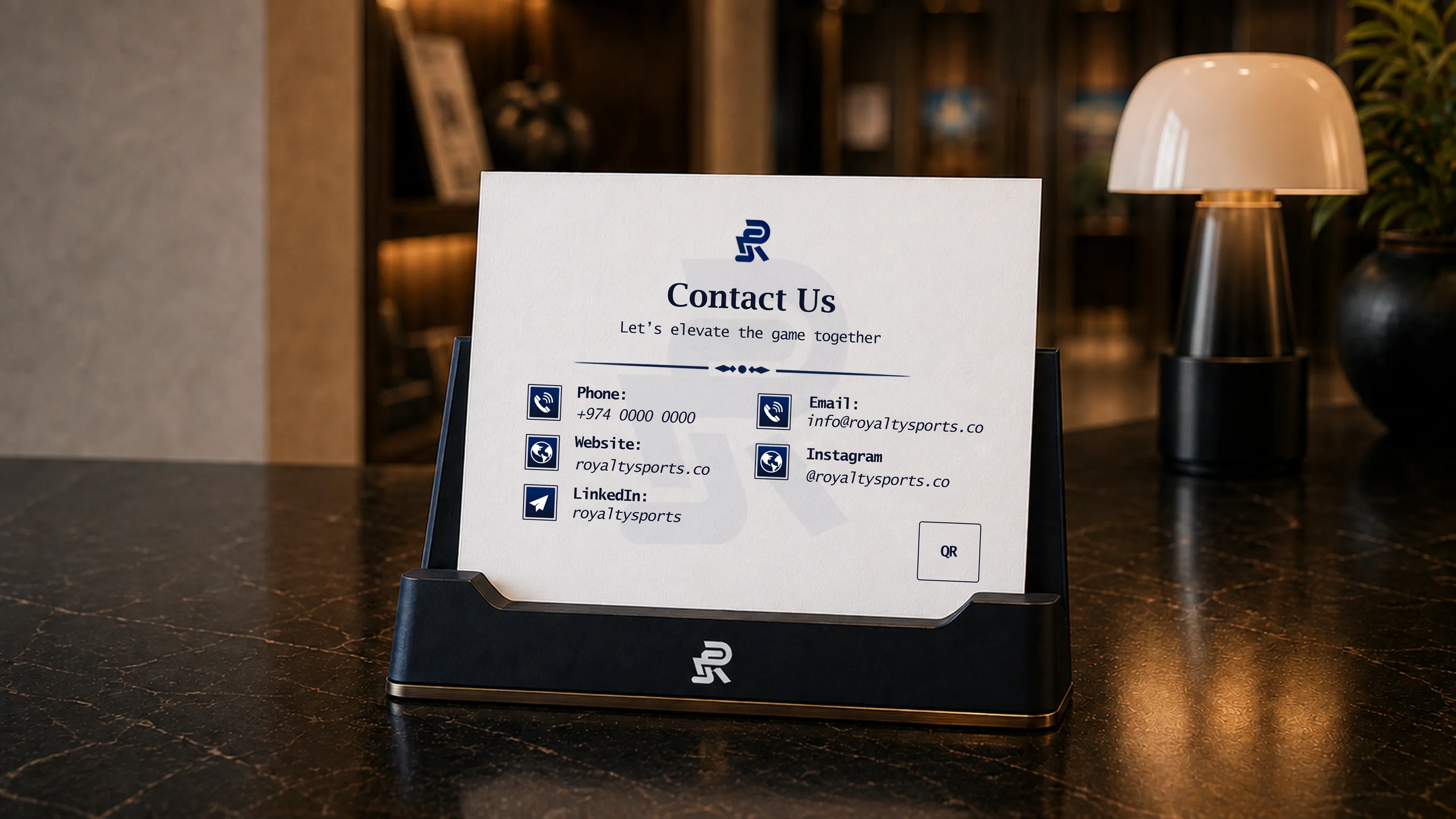 The Royalty Sports contact card on the reception desk.
